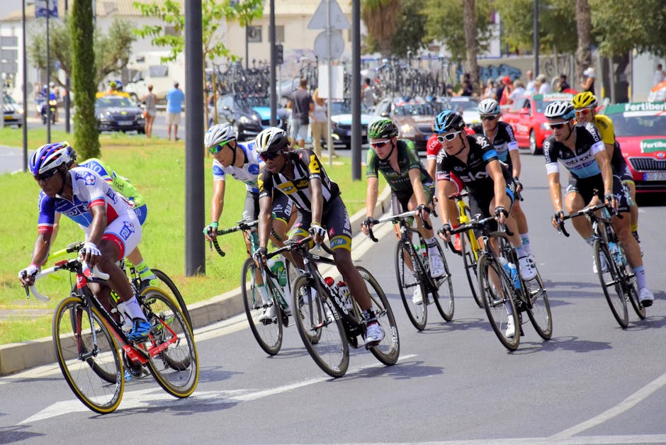 Group of professional cyclists competing in a road race, showcasing endurance and teamwork in a vibrant urban setting.