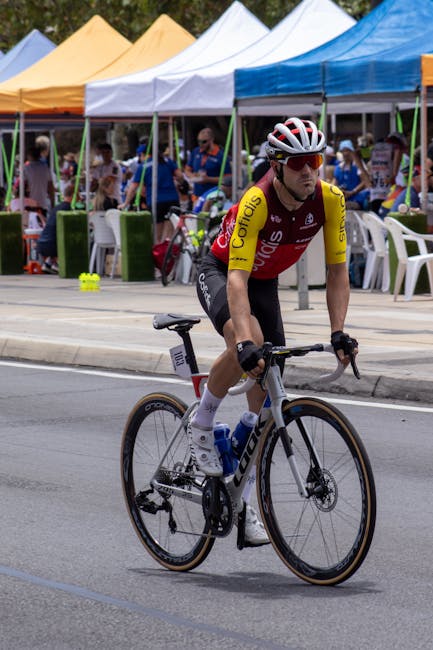 Cyclist in professional gear racing in a street event in Adelaide, South Australia.