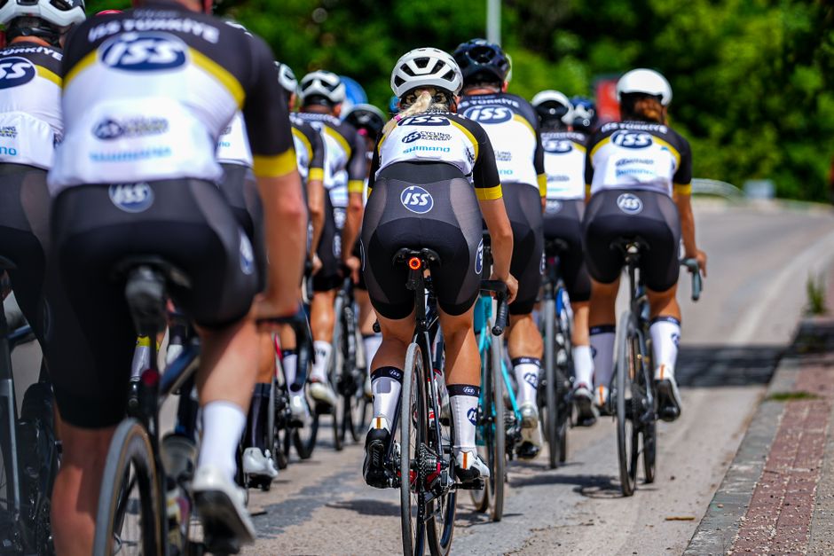 Group of professional cyclists competing in a street race in Bursa, Türkiye.